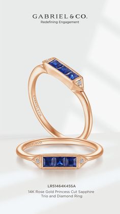 an engagement ring with blue sapphire stones on the band and diamond setting in 18k rose gold