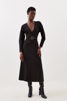 Experience Elevation In Your Every Day Wardrobe With Our Midi Dress, Featuring A Flared Silhouette That Flatters The Curves, With A Belted Waistline To Cinch The Silhouette, And A Plunging V Neckline. Style It With Block Heels Or Loafers For A Casual Approach, Then Strappy Stilettos For An Occasion Look. Ponte Belted Midi Dress High Quality Ponte Fabric Flattering Fit And Flare Silhouette Cinched, Belted Waistline Deep V Neckline Zip Back Fastening V-neck Belted Midi Dress For Date Night, Chic Belted Midi V-neck Dress, Chic Belted V-neck Midi Dress, Fitted Belted Midi Dress For Night Out, Chic Black V-neck Dress For Work, Belted V-neck Maxi Dress For Work, Fitted V-neck Dress For Workwear In Fall, Fitted V-neck Dress For Work In Fall, Fitted V-neck Dress For Work