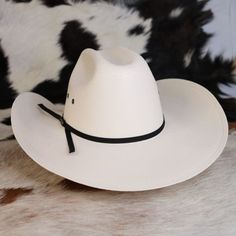 Let your little buckaroo play the part in this one size fits most hat that features a cattleman crown, black string hat band, and venting eyelets. One Size Fits Most (50 -53 CM) 3.75" brim Stretchy Elastic Band inside Cattleman Crown Western Hats With Adjustable Fit For Country Events, Adjustable Country Hats For Western-themed Events, Adjustable Hats For Rodeo, Country Style Hat With Flat Brim For Ranch, Western Fedora With Adjustable Fit, Country Style Top Hat With Curved Brim For Ranch, Western Style Fedora With Adjustable Fit, Country Style Top Hat With Curved Brim, Country Style Flat Brim Hat For Ranch