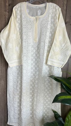 Soft cotton hand embroidered Kurta in soft cream color ! Length:47 inches   Matching Cotton Liner Included Cream Straight Kurta For Spring, Cream Kurta With Floral Embroidery For Diwali, Cream Chikankari Embroidery Traditional Wear For Eid, Spring Cream Chikankari Traditional Wear, Spring Off White Kurta With Chikankari Embroidery, Cream Kurta With Floral Embroidery For Spring, Traditional Cream Kurta With Resham Embroidery, Off White Kurta With Chikankari Embroidery For Spring, Cream Embroidered Kurta For Spring