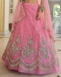 COLOR : Shimmering Blush Pink FABRIC : Top (Blouse) - Soft Net, Bottom (Lehenga) - Soft Net, Dupatta - Soft Net WORK : Heavy Metallic Thread Embroidery, Zari Work, Cutwork, Sequins, Motifs, Lace Border OCCASION : Wedding, Reception, Sangeet, Engagement READY-TO-WEAR : NoSTITCHING : Available as semi-stitched fabric, can be stitched using standard size option (+$30). Note: There might be a slight color variation due to lighting and flash used during photoshoot. The bright shade seen is the best c Blush Pink Fabric, Holiday Promotions, Embroidered Wedding, Zari Work, Wedding Lehenga, Net Dupatta, Thread Embroidery, Lace Border, Metallic Thread