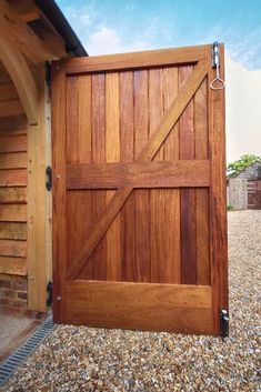 a close up of a wooden door on gravel