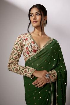 Emerald green saree with sequin, badla embroidery. Paired with beige floral print blouse. - Aza Fashions Festive Semi-stitched Pista Green Blouse, Fitted Green Pre-draped Saree With Mirror Work, Green Georgette Choli For Transitional Season, Festive Green Georgette Top, Transitional Green Georgette Choli, Green Anarkali Georgette Blouse, Anarkali Green Georgette Blouse, Green Georgette Top For Wedding, Transitional Green Saree With Mirror Work