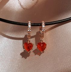 "Ruby Heart Earrings, Necklace, or Set. NEXT DAY SHIPPING * * Dimensions & Material ∙ The chain type is Twist, the chain length is 14\", and it comes with a 2\" extender so you can fine-tune. ∙ Chain types are 18K Gold Plated over Stainless Steel Chain (1.5 microns) - except Figaro (S), which is 18K Gold-Filled over Brass ∙ Pendant is 18K Gold Plated over Brass. ∙ Pendant stone is Cubic Zirconia ∙ Hoop Size: 12 mm ∙ Hoops are Gold-Filled over Brass ∙ Charm Size: 7 x 8.5 mm ∙ The necklace is %100 Heart Huggies, Garnet Heart, Red Heart Earrings, Sugar Land, Heart Dangle Earrings, Red Jewelry, Earrings Red, Girly Jewelry, Jewelry Inspo