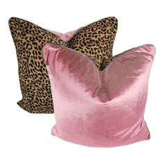 two pink pillows with leopard print on them