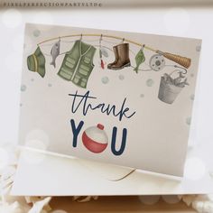 a thank you card with clothes hanging on a line