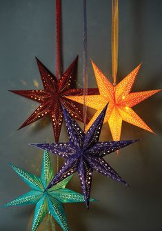 three star shaped lights hanging from strings