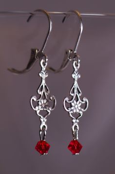 Victorian style earrings with 4 mm Swarovski Red crystals. The Earring are 1 1/2 inches long. Elegant Red Single Clip-on Earring, Red Chandelier Earrings As Gift, Red Sterling Silver Earrings For Wedding, Elegant Red Drop Earrings, Red Jewelry For Pierced Ears As A Gift, Nickel-free Red Crystal Earrings, Red Nickel-free Crystal Earrings, Red Handmade Dangle Crystal Earrings, Red Handmade Crystal Dangle Earrings