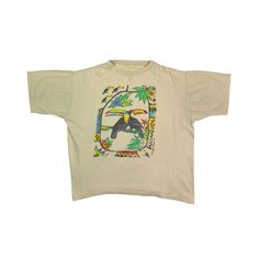 "Vintage 1992 Gallagher Brothers Toco Toucan T-shirt  Used condition. See pics! THIS IS USED ITEM ! PLEASE DONT EXPECTED IT TO BE LIKE NEW OR IN PRISTINE CONDITION ! Size on tag: lost. Please check the measurements! Measurements: Shoulders: 56 cm. (22\") Pit to Pit: 62 cm. (24.4\") Length: 65 cm. (25.5\") Worldwide shipping: Approximate delivery time 14-30 days. Please be careful and ask any specific questions about item before purchasing. I can send you additional details photos as needed." Tropical Multicolor Graphic T-shirt, Tropical Multicolor Graphic Print T-shirt, Toco Toucan, Animal Graphic Tee, Birds Nature, Star Top, Nature Animals, Graphic Tees, Cute Outfits