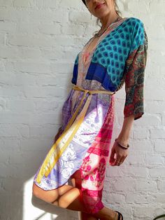 "This is one of a kind patchwork, upcycled silky robe Made free size with wrap tie closing  Easy and fun to wear around the house or outside as a urban boho style,  flowy kardigan with jeans and tshirt  It is very comfy and feels soft and light  the material is colourful and lightweight  made into this unique stylish over all MEAESURE free size length 40\" MATERIAL *vintage silk  * no lining more available at  https://www.etsy.com/shop/AltheaStores? CARE INSTRUCTIONS  * Wash in warm water * Hand Colorful Kimono, Urban Boho, Silky Robe, Pool Bath, House Coat, Up House, Womens Robes, T Shirt And Jeans, Beautiful Skirts