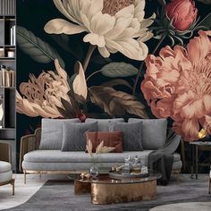 a living room filled with furniture and flowers on the wall behind a large floral mural