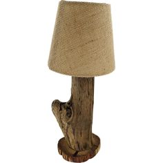 a lamp made out of wood and burlock with a light shade on it