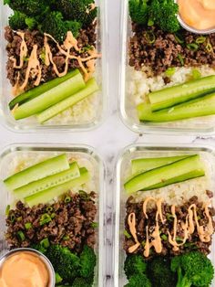 four plastic containers filled with rice, broccoli and other food items next to dipping sauce