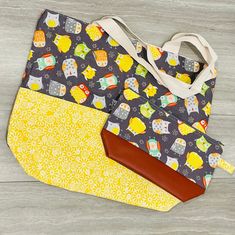 This large tote bag with matching zippered cosmetic bag is the perfect gift for any occasion! Makes a wonderful diaper bag, beach bag or weekender bag! Tote bag: - measures approximately 18.5 inches wide by 15 inches long with a 5 inch wide bottom - two identical pockets on the front - metal snap closure - heavy-duty canvas lining - cotton design - designed to hold up to 25 pounds Zipper cosmetic bag: - made of cotton and faux leather - measures approximately 10.5 inches long by 7 inches high with a 3 inch wide bottom Please message with any questions or for custom orders (including sports teams) or bulk orders :) Everyday Tote Cosmetic Bag With Zipper, Daily Use Cosmetic Tote With Zipper, Large Capacity Tote Pouch For Gifts, Tote Cosmetic Bag With Zipper, Large Capacity Tote Cosmetic Bag Gift, Gift Tote Bag With Zipper Pocket, Everyday Use Tote Cosmetic Bag With Removable Pouch, Everyday Cosmetic Tote Bag With Removable Pouch, Everyday Use Cosmetic Tote Bag With Removable Pouch