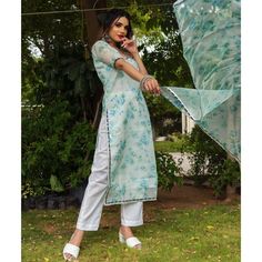 Make an everlasting impression at any upcoming festive occasion in our beautiful chanderi kurta set comprising a cotton pants. The kurta set features a round neckline, and lace at the front neck ,elbow sleeves, and printed organza dupatta. Pair it with traditional chaandbali earrings and pearl earrings to complete the overall look . SKU#: 11403217GR Disclaimer: There may be slight difference in actual product color compared to product images. Organza Kurta, Chanderi Suit, Readymade Salwar Kameez, Salwar Pattern, Chanderi Suits, Organza Dupatta, Kurta With Pants, Salwar Suit, Elbow Sleeve