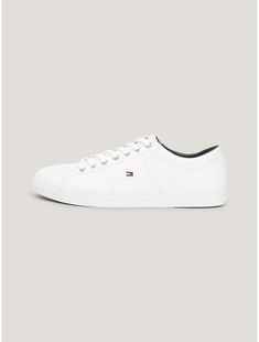 Tommy Hilfiger men's sneaker. The understated design of these low-cut leather sneakers make them the pair that goes with just about everything, Made complete with a generously padded footbed.  Material: 100% Leather (fwa). Classic Leather Lace-up Skate Shoes, Modern Leather Skate Shoes With Textured Sole, Tommy Hilfiger Lace-up Sneakers With Embossed Logo, Modern Leather Skate Shoes With Vulcanized Sole, Classic Low-top Skate Shoes With Embossed Logo, Leather Slip-on Skate Shoes, Classic Lace-up Skate Shoes With Embossed Logo, Leather Low-top Skate Shoes For Everyday, Casual Leather Skate Shoes With Cushioned Footbed