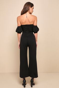 Make headlines in the style section with the Lulus Impress Release Black Off-the-Shoulder Puff Sleeve Jumpsuit! Medium-weight, stretchy crepe knit creates an off-the-shoulder neckline (with hidden no-slip strips), a ruched bodice, and short puff sleeves with elastic at the shoulders and banded cuffs. High waist sits above cropped wide pant legs. Hidden back zipper. Fit: This garment fits true to size. Length: Ankle length. Size medium measures 47.75" from shoulder to hem. Inseam: 25.50 Front Ris Stretch Off-shoulder Solid Jumpsuits And Rompers, Off-shoulder Stretch Jumpsuit For Night Out, Fitted Strapless Off-shoulder Top For Evening, Stretch Off-shoulder Jumpsuit For Night Out, Elegant Off-shoulder Top, Chic Stretch Strapless Off-shoulder Jumpsuit, Chic Off-shoulder Stretch Strapless Jumpsuit, Fitted Off-shoulder Black Romper, Black Fitted Off-shoulder Strapless Jumpsuit