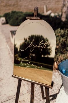 an easel with a sign that says happily and george