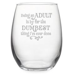 a wine glass that says being an adult is by far the dumbest thing i've ever done