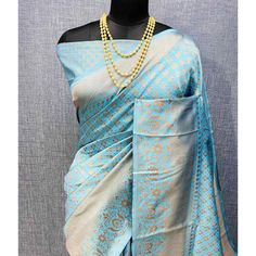 Light Blue colored saree is made from banarasi silk fabric which is highlighted with beautiful weaving work as shown. Comes along with unstitched banarasi silk blouse piece which you can customise as per your design/style. Occasion - You can wear this saree for festivals and functions. Note:- the actual product may differ slightly in color and design from the one illustrated in the images when compared with computer or mobile screen. Measurements: Saree : Banarasi Silk : 5.5 Mtrs Blouse : Banarasi Silk : 0.8 Mtr Material: Banarasi Silk Stitch Type: Unstitched Country of Origin: India Care Guide: Dry Clean Blue Bollywood Banarasi Silk Pre-draped Saree, Blue Wedding Pre-draped Saree With Zari Weaving, Blue Katan Silk Pre-draped Saree With Zari Work, Elegant Blue Pre-draped Saree For Puja, Blue Jamawar Pre-draped Saree With Zari Weaving, Blue Slub Silk Pre-draped Saree With Unstitched Blouse, Blue Tussar Silk Pre-draped Saree With Dupatta, Blue Pre-draped Saree With Zari Weaving, Blue Pre-draped Saree With Unstitched Blouse For Puja