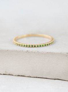 Eternity Ring - Gold + Emerald – The Faint Hearted Gold Emerald Ring With Pave Setting, Gold Emerald Ring With Pavé Setting, Gold Emerald Rings With Pave Setting, Gold Emerald Ring With Pave Setting As Gift, Gold Emerald Half Eternity Ring, Gold Emerald Ring With Half Eternity Design, Gold Emerald Half Eternity Jewelry, Gold Jewelry For May Birthstone With Half Eternity, Gold Half Eternity Jewelry For May Birthstone