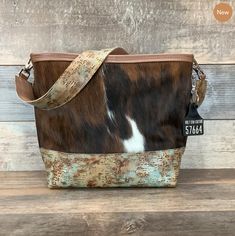 😍Only 3 left! Our new Messenger bags sell out quick! 🌵Which is your favorite? 👉Link in bio or Click Here -----> http://ow.ly/O2xr50MLnxC #Accessories #Handbag #Bag #westernpurse #westernfashion #bestwesternpurse #leathertote #leatherbag #haironhidebag #bohofashion #yellowstonefashion #texasfashion #rodeofashion #missrodeofashion #westerninfluencer #bestwesternpurse #westerncouture #western #holycowcouture #hcc #leatherfashion #ofy