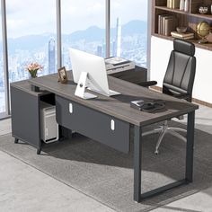 an office desk with a computer on it in front of a window overlooking the city