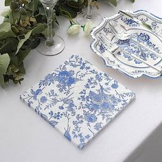 the table is set with blue and white china