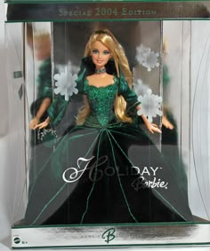 the barbie doll is wearing a green dress