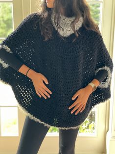 Handmade All Season Black Crochet Poncho Cape. Whether you are heading to a festival, the beach or just want to dress up a tank top this handcrafted shawl will become a staple in your closet. Soft and lightweight allowing your skin to breath freely. Handmade with only the finest materials that is perfect for covering your shoulders and mid section. It pairs well with shorts, jeans, skirts, dresses and more.  A fashionable cover up that makes an amazing gift to yourself, friend or loved one.  SPECIFICATIONS * Black Crochet Poncho * Measurement: 25 inch H x 32 inch W * Wool - Acrylic mix yarn * This Authentic and Luxurious Throw is completely Handmade by us with beautiful patterns. * Made In Argentina and Handmade This size is approx and may vary slightly due to the handmade process.  CARE I Traditional Black One-size Poncho, Black Knitted Poncho One Size, Black Bohemian Poncho One Size, Black Knitted One-size Poncho, Handmade Black Poncho One Size, Handmade Black Poncho For Festivals, Handmade One Size Poncho For Festivals, Handmade One-size Poncho For Festivals, One-size Crochet Poncho For Festivals