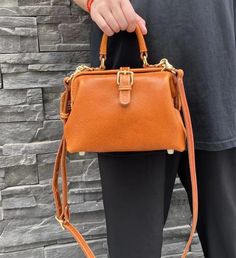 MATERIAL - Made of 100% high quality full-grain leather (Italy vegetable-tanned leather), solid color, feels cosy to touch,delicate, durable. The hardware parts are made of cast molding thick hardware, top metal hardware. The stitching is well-made, firm and smooth. YKK zipper.DIMENSIONS - 7.5L*3.3W*5.9H(inch) / 19L*8.5W*15H(cm)STRUCTURE - This doctor bag contains 1 main compartment, 1 inner slip pocket, 1 inner zipper pocket, 1 back slip pocket. Comfortably holds wallet, mobile phone, cosmetics Classic Leather Box Bag With Palladium Hardware, Leather Box Bag With Palladium Hardware For Everyday Use, Everyday Leather Box Bag With Palladium Hardware, Classic Leather Box Bag With Metal Hardware, Leather Box Bag With Metal Hardware For Office, Leather Office Box Bag With Metal Hardware, Office Leather Box Bag With Metal Hardware, Leather Box Bag With Metal Hardware For Everyday Use, Doctor Bag