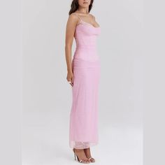 This elegant pink bodycon dress marries the structure and figure-flattering properties of corsetry with the delicate allure of sheer mesh, all while maintaining a light, ethereal aesthetic through its pink color and delicate spaghetti straps. It's a perfect choice for formal events, romantic evenings, or any occasion where making a stylish, impactful appearance is desired. Styling Tip:Heeled sandals or pumps in neutral colors like nude, white, or light pink can elongate the legs and complement t Elegant Spaghetti Strap Mesh Dress For Prom, Elegant Mesh Dress With Spaghetti Straps For Prom, Fitted Mesh Dress With Spaghetti Straps For Evening, Elegant Pink Corset Dress With Sheer Bodice, Elegant Sheer Corset Dress With Spaghetti Straps, Elegant Sleeveless Dress With Transparent Straps, Pink Spaghetti Strap Corset Dress For Party, Pink Corset Dress With Spaghetti Straps For Night Out, Pink Corset Dress With Spaghetti Straps For Parties