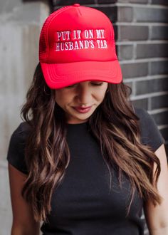 You'll be wearing this trucker hat on repeat! Our newest red trucker hat is a funny nudge at all the wonderful hubby's out there! Red trucker hat White "Put it on my husband's tab" embroidered on the front Adjustable snapback closure Breathable mesh on the back Designed in the U.S.A. Produced in China. Red Trucker Hat One Size Fits Most, Red Trucker Hat One Size, Red Trucker Baseball Cap Snapback, Red Trucker Snapback Baseball Cap, Fun Red Adjustable Trucker Hat, Red Adjustable Fun Trucker Hat, Red Trucker Snapback Hat, Fun Red Trucker Hat, Red Snapback Trucker Hat