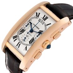 Cartier Tank Americaine Chronograph Rose Gold Mens Watch W2609356. Automatic self-winding movement. 18K rose gold case 52.0 x 32.40 mm. Circular grained crown set with faceted blue sapphire. Transparent exhibition saphire crystal case back. . Scratch resistant sapphire crystal. Silvered guilloche dial with black roman numerals. Blued Steel hands. Secret Cartier signature at VII. Date display at the 12 o'clock position. Three chronograph sub-dials -- 12 hours, 30 minutes, and 60 seconds. Brown le Elegant Cartier Watch With Tachymeter, Formal Cartier Watch With Tachymeter, Luxury Cartier Watch With Tachymeter, Luxury Formal Chronograph Watch With Tachymeter, Luxury Formal Watch With Tachymeter, Luxury Chronograph Watch With Subdials For Anniversary, Anniversary Chronograph Watch With Rectangular Dial, Elegant Rose Gold Chronograph Watch With Tachymeter, Formal Yellow Gold Chronograph Watch With Chronometer