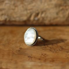 A true Western Classic - Mother of Pearl Ring. Stunning quality, big, Mother of Pearl is as if poured into the sterling silver bezel. Mesmerizing. Our Boho Ring staple design is the perfect backdrop for this star. The Boho Ring design looks and feels like it was made by a master silversmith from another time. Here in stunning Mother of Pearl. The boho, classic design with the .925 Sterling Silver twist wire and double, half-round split shank make it feel like you're sliding on something that som Silversmith Rings, Fluorite Ring, Blue Chalcedony Ring, Chloe Ring, Mother Of Pearl Ring, Purple Amethyst Ring, Purple Rings, Chalcedony Ring, Baltimore Md