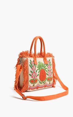 Get the party started with the Franny Fringe Fiesta Tote! This playful mini tote bag features fully embellished front and fringed edge details. Carry it by the two rounded top handles or switch it up with the detachable shoulder strap. The open top with magnetic closure makes for easy access to the fully lined interior, complete with slip and zip pockets. Size: 14" x 9" x 3.5" Mini Tote Bag, Get The Party Started, Mini Tote, Open Top, Magnetic Closure, Uganda, Shoulder Strap, Two By Two, Handles