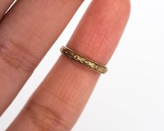 * VIEW A VIDEO OF THIS RING: https://youtu.be/397NvKpaGB4 * Description: Gorgeous antique baby ring circa 1920!. This ring is handcrafted in 14k yellow gold and is the perfect accessory for any baby. The band has a marvelous floral design running along the entire band. This is a true antique piece, and we are honored to offer it to our Etsy family. Item Details: Ring Size: .75 Metal Type: 14K Yellow Gold Weight: 0.6 grams Finger to top of Stone Measurement: 1.12mm Payment & Refund Details: * Vintage Yellow Gold Engraved Ring With Round Band, Antique Engraved Round Band Ring, Vintage Engraved Yellow Gold Ring With Round Band, Vintage Yellow Gold Engraved Ring, Antique Engraved 14k Gold Ring With Round Band, Yellow Gold Brass Stackable Rings For Wedding, Vintage Yellow Gold Rings With Decorative Band, Heirloom Yellow Gold Stackable Brass Rings, Antique Engraved Round Band Ring As Gift