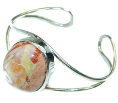 Handmade Unique 925 Sterling Silver bracelet with unique one of a kind Mexican Fire Opal,  31.90 grams of marvelous handcrafted jewelry design. Only one piece availble ready to ship! It's unique worldwide bracelet - simply piece of art in world of fine jewelry. Norwegian Northern Lights  Mexican Opal  handmade .925 Sterling Silver Bracelet / Cuff  BRACELET DETAILS: Weight: 31.90g; Material: Sterling Silver; Main stone: Mexican Fire Opal; Width (widest section): 1 3/8 inch; Inner circumference: 6 Silver Sterling Silver Cuff Bracelet With Cabochon, Silver Cabochon Cuff Bracelet Gift, Unique Cabochon Cuff Bangle Bracelet, Unique Cabochon Bangle Bracelets, Unique Jewelry With Oyster Bracelet, Unique Silver Bracelet With Cabochon, Adjustable Sterling Silver Cuff Bracelet With Cabochon, Adjustable Cabochon Sterling Silver Cuff Bracelet, Adjustable Sterling Silver Cabochon Cuff Bracelet