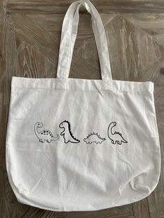 This reusable tote bag is perfect for every occasion!  Size: 13.5" x 13.5" x 4" Trendy Reusable Rectangular Canvas Bag, Casual Reusable Tote Bag, Casual Reusable Tote Shoulder Bag, Trendy White Reusable Bags, Casual White Reusable Bags, White Reusable Bags For Daily Use, Reusable White Bags For Daily Use, Trendy Everyday Reusable Shoulder Bag, White Reusable Daily Use Bags