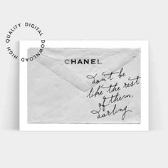 a black and white photo with the words chanel written in cursive writing