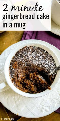 a close up of a cake in a bowl on a plate with the words, 2 minute gingerbread cake in a mug