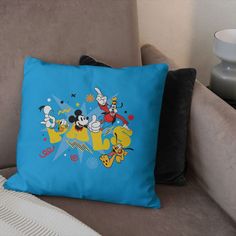 a blue pillow sitting on top of a couch