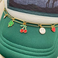 Add some bling and personality to your trucker hat or baseball cap. This lucky style is so trendy with cherry, clover, hearts, & smiley charms. Clasps included and are easily attached to the mesh on the cap. Take your style up a notch! Cap not included. //CAP CHAIN SHOWN IN LISTING// Lightweight Large Paper clip link chain gold plated Clasps on ends to attach in mesh Nickel Free components Chain part measures 8″ Fits trucker or regular ball caps Jewelry arrives gift ready in a lovely box. //CARE Trendy Handmade Hats, Trendy Hats With Adjustable Chain, Trendy Gold Hat As A Gift, Trendy Adjustable Gold Trucker Hat, Gold Adjustable Trucker Hat Trendy, Trendy Trucker Hat As Gift, Trendy Trucker Hat Gift, Trendy Adjustable Trucker Hat As Gift, Work Shirt Outfit