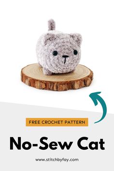 a crocheted stuffed animal sitting on top of a wooden stump with the text free crochet pattern no - sew cat