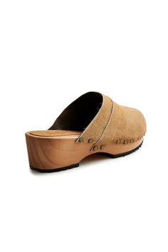 Cow hair classic low heel leather clogs in camel. Comfortable 1 7/8" pine wood mid heel. Leather lined. Made in Spain. Fit is true to size. Half sizes should order up. Save SaveSave