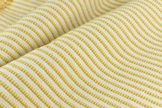 yellow and white fabric with wavy lines