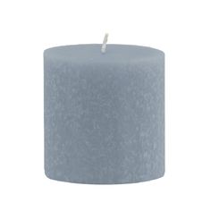 a blue pillar candle on a white background