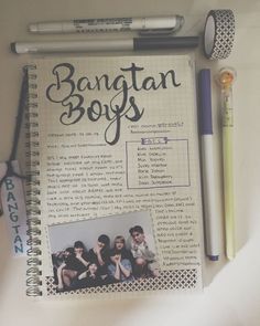 an open notebook with the words bantan boys on it