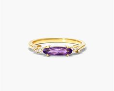 14K Yellow Gold Fairy Amethyst and Diamond Ring by Brevani. This 14K yellow gold ring appears to be taken out of a fairy tale! The diamonds on the ring band flicker next to an oval amethyst. Amethyst And Diamond Ring, A Fairy Tale, Finger Rings, Yellow Gold Ring, Yellow Gold Rings, Fairy Tale, Gold Ring, Fashion Rings, Sapphire Ring