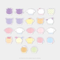 a bunch of different colored stickers on a white background